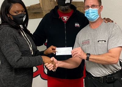 SMFR presenting Sozo’s with a $500.00 check